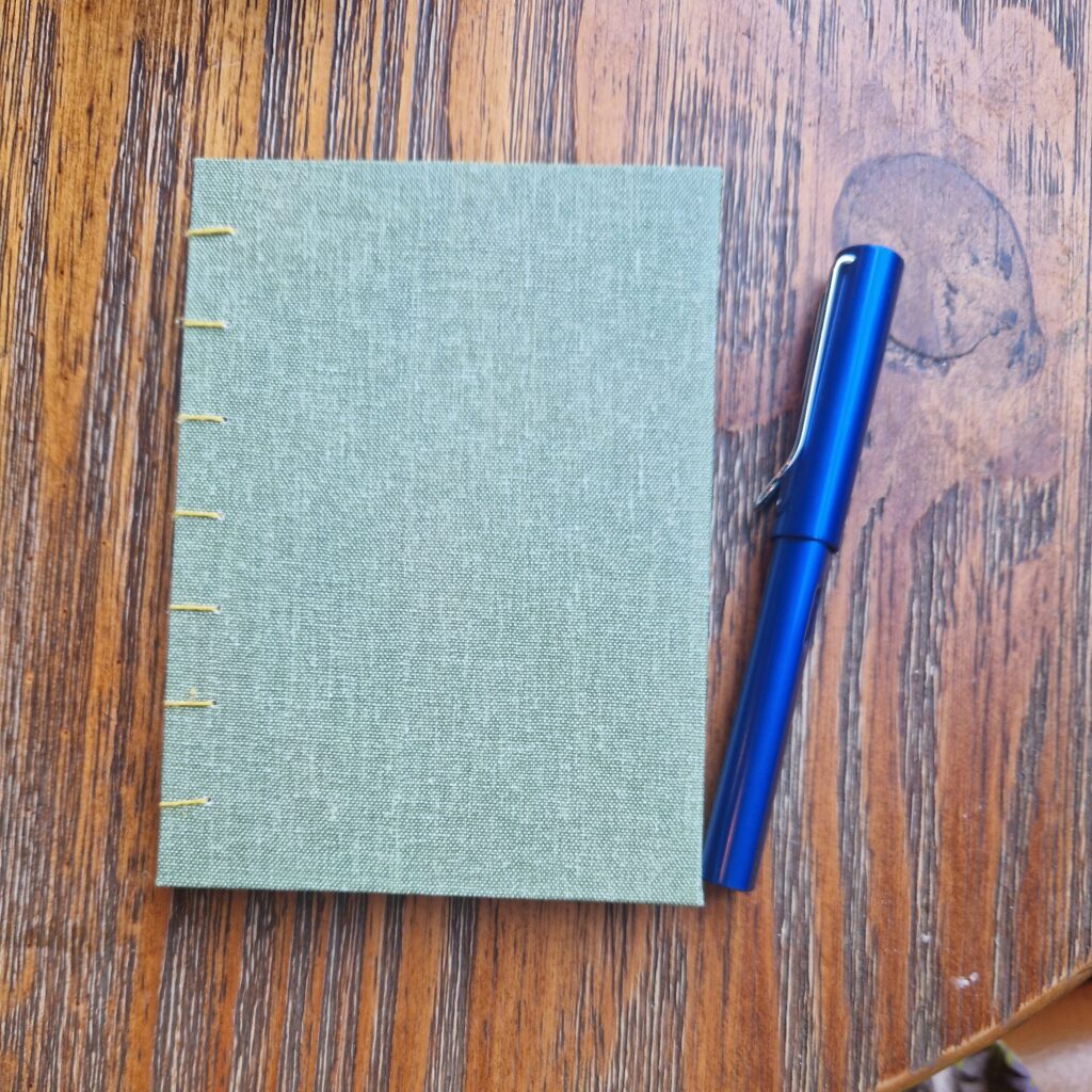 hand-made book and fountain pen